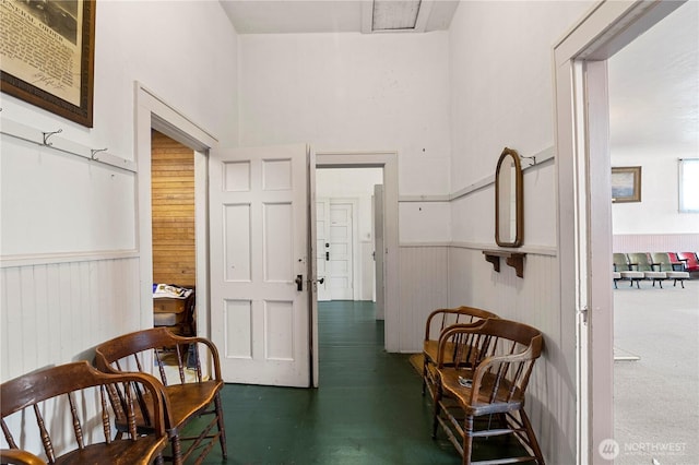 interior space featuring a wainscoted wall