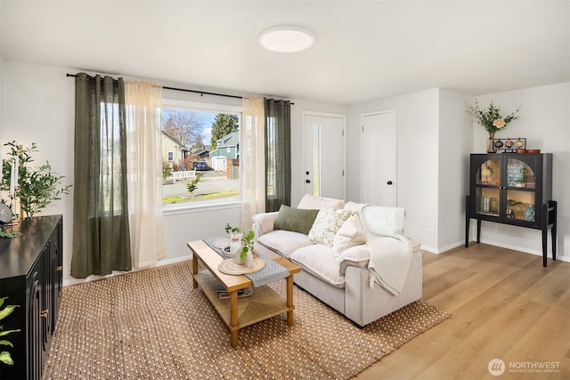 sitting room with light wood-style floors and baseboards