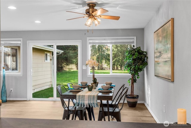 dining room featuring recessed lighting, wood finished floors, and baseboards