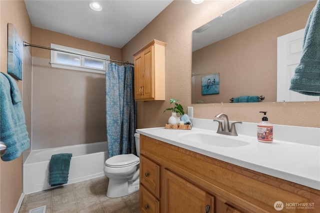 full bathroom with shower / bathtub combination with curtain, vanity, and toilet