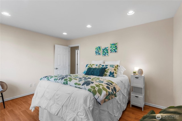 bedroom with baseboards, light wood-type flooring, and recessed lighting