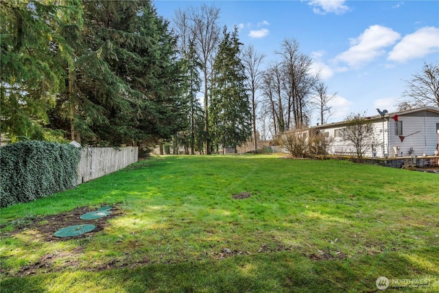 view of yard with fence