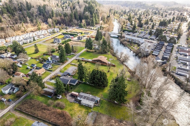 drone / aerial view featuring a water view and a residential view