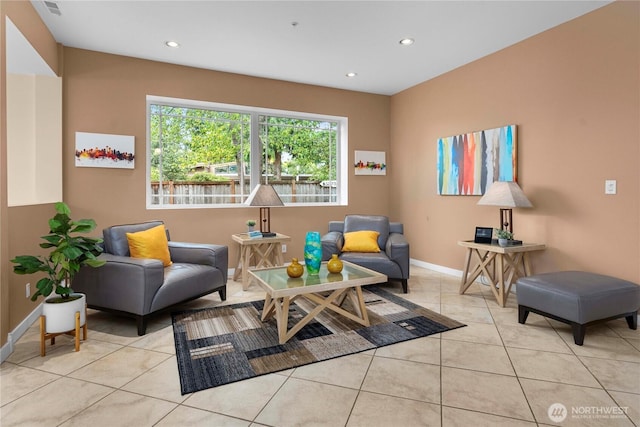 sitting room featuring light tile patterned floors, baseboards, and recessed lighting