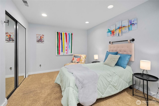 bedroom with visible vents, baseboards, carpet floors, a closet, and recessed lighting