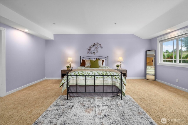 carpeted bedroom featuring recessed lighting, vaulted ceiling, and baseboards