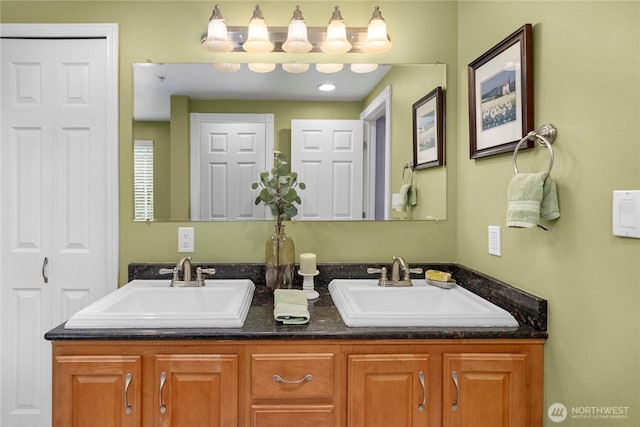 bathroom featuring double vanity and a sink