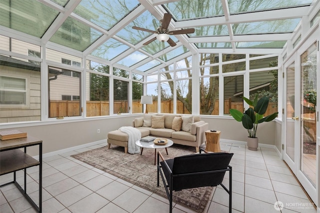 sunroom with a ceiling fan and vaulted ceiling