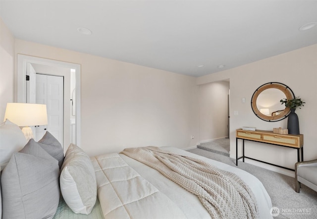 bedroom with baseboards and carpet flooring