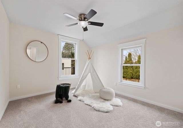 game room with baseboards, vaulted ceiling, and carpet flooring