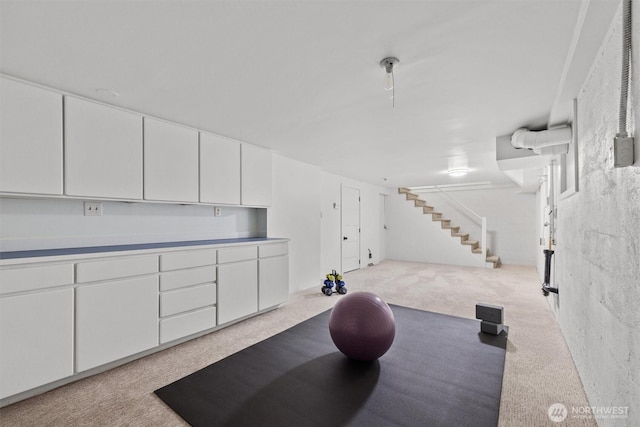 workout room featuring carpet floors