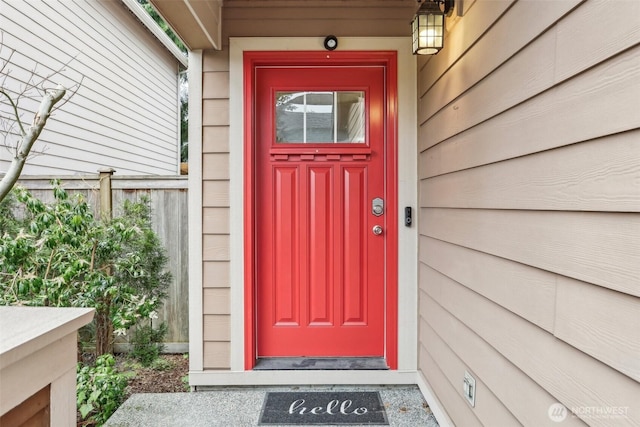 doorway to property with fence