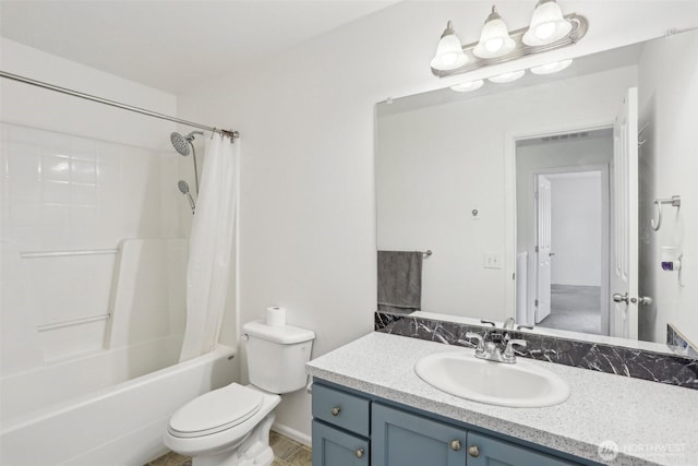 bathroom with shower / bath combination with curtain, toilet, and vanity