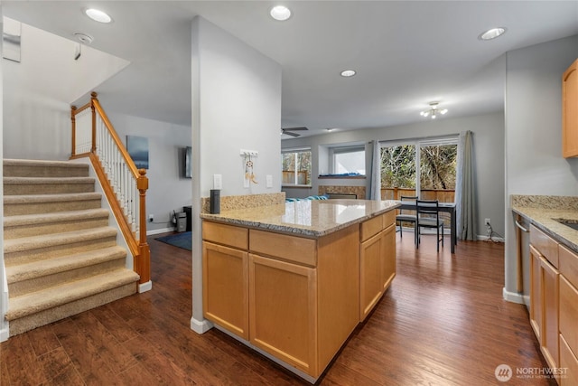 kitchen with recessed lighting, light brown cabinets, dark wood finished floors, and light stone countertops