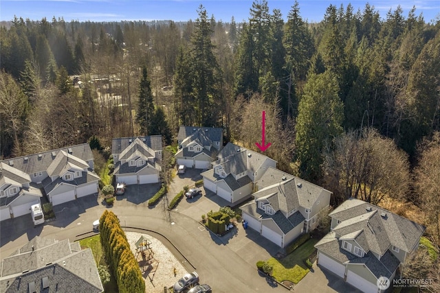 aerial view with a residential view and a wooded view