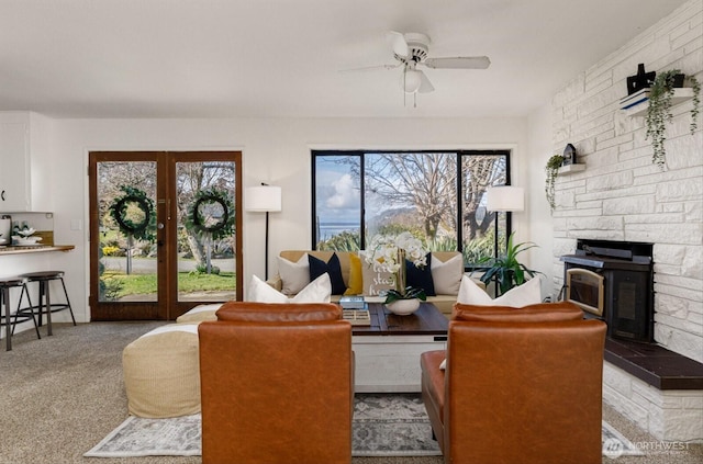 living room with carpet and a ceiling fan