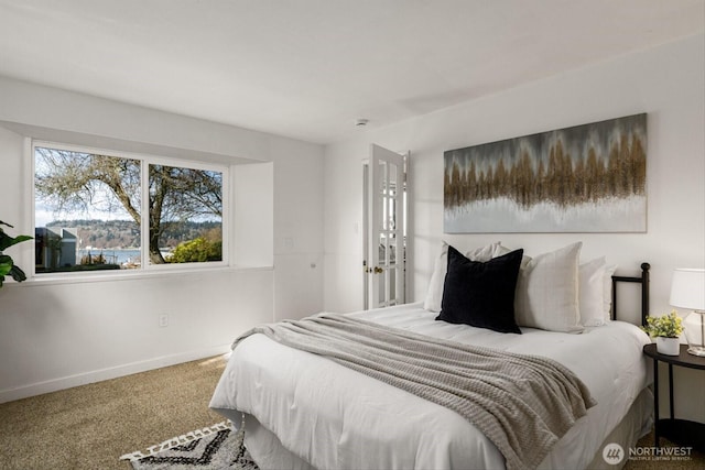 bedroom with carpet and baseboards