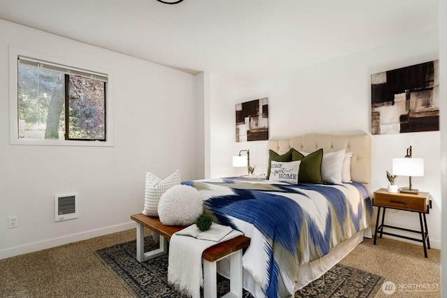 carpeted bedroom featuring visible vents and baseboards