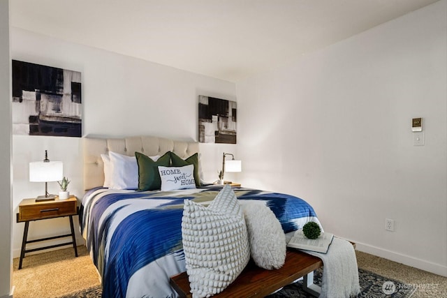 bedroom featuring carpet and baseboards