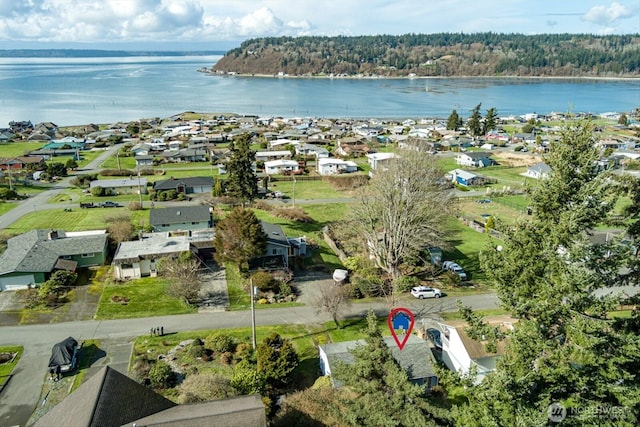 drone / aerial view featuring a residential view and a water view