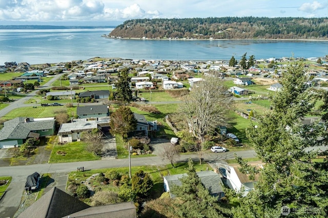 birds eye view of property featuring a residential view and a water view