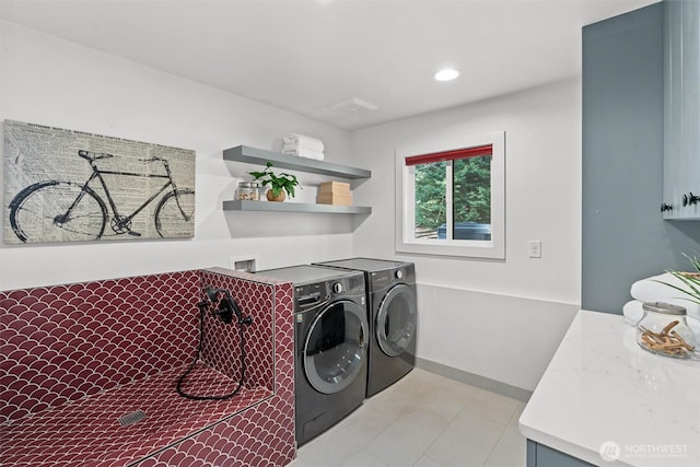 clothes washing area featuring laundry area, baseboards, washer and dryer, and recessed lighting