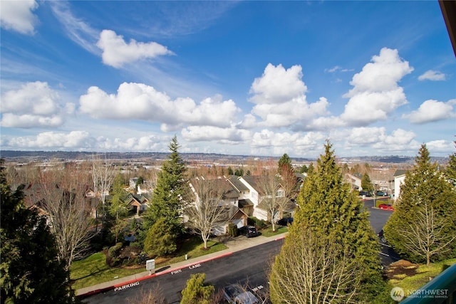 birds eye view of property with a residential view