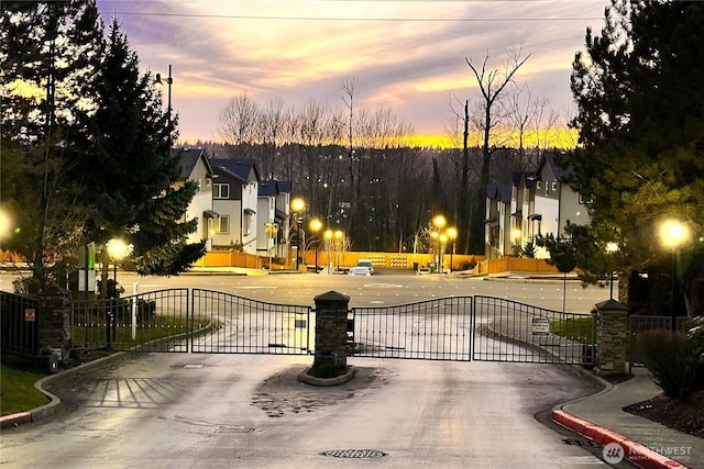 view of gate at dusk