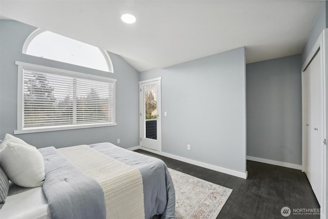 bedroom with recessed lighting, baseboards, vaulted ceiling, a closet, and dark wood-style floors