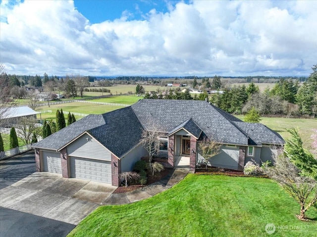 10808 NE 192nd Ave, Brush Prairie, WA 98606 - single story home with concrete driveway, brick siding, a garage, and a front yard