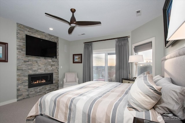 10808 NE 192nd Ave, Brush Prairie, WA 98606 - carpeted bedroom featuring visible vents, a fireplace, a ceiling fan, and access to outside