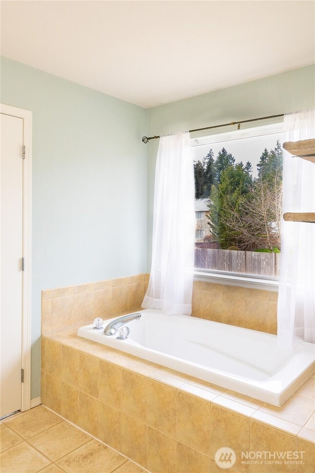 full bathroom with tile patterned flooring and a garden tub