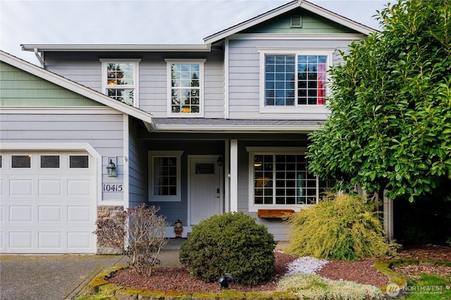 view of front facade with a garage and covered porch