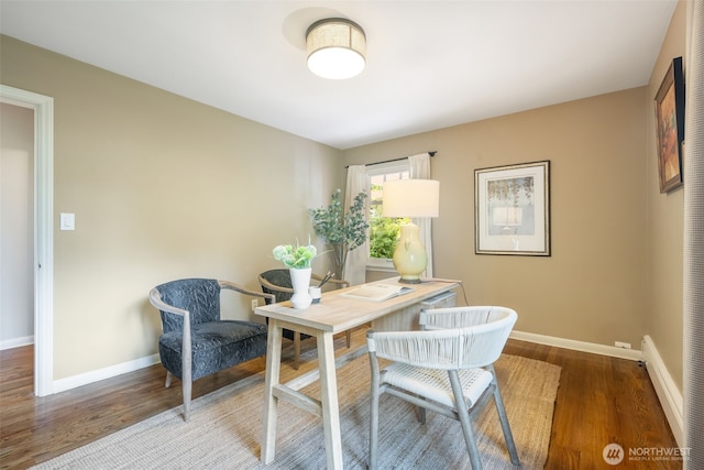 office with wood finished floors and baseboards