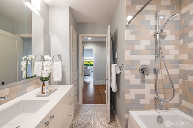 bathroom with vanity, shower / bathtub combination, and a baseboard radiator