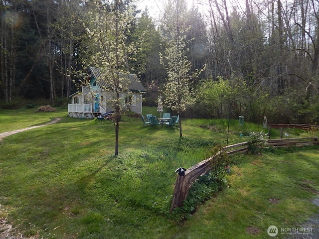 view of yard featuring a wooded view