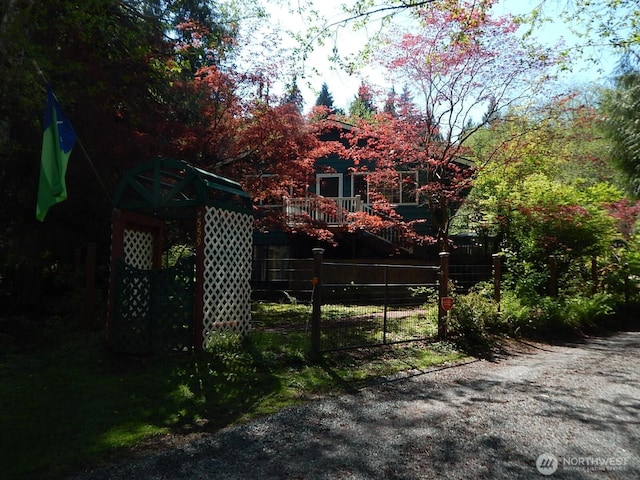 view of gate with fence