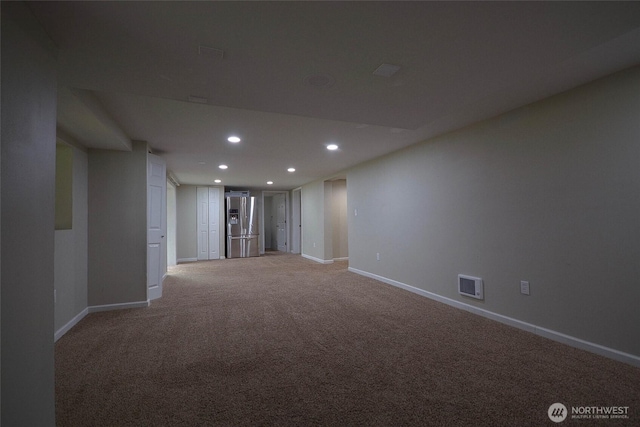 unfurnished room with visible vents, recessed lighting, baseboards, and carpet floors