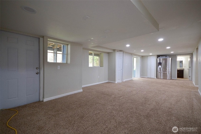 interior space with recessed lighting, baseboards, carpet, and stainless steel refrigerator with ice dispenser