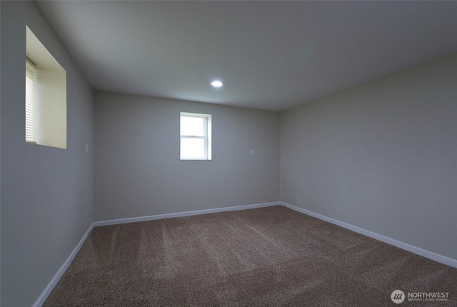 carpeted empty room featuring recessed lighting and baseboards