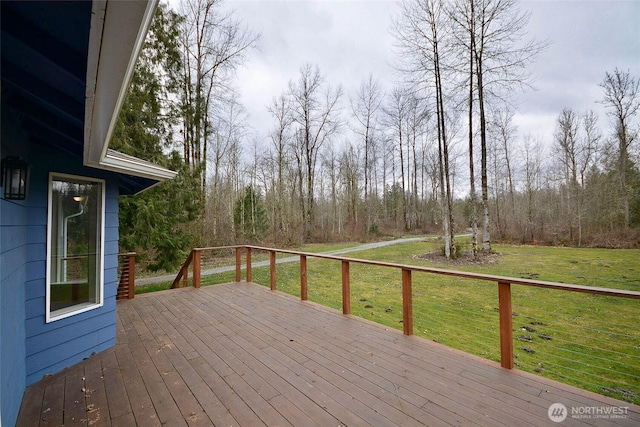 wooden deck with a lawn