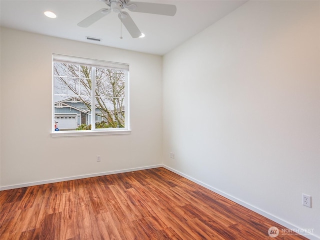 unfurnished room featuring recessed lighting, visible vents, a ceiling fan, wood finished floors, and baseboards