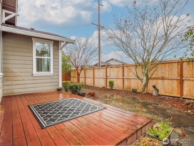 wooden deck featuring fence