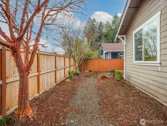 view of yard with a fenced backyard