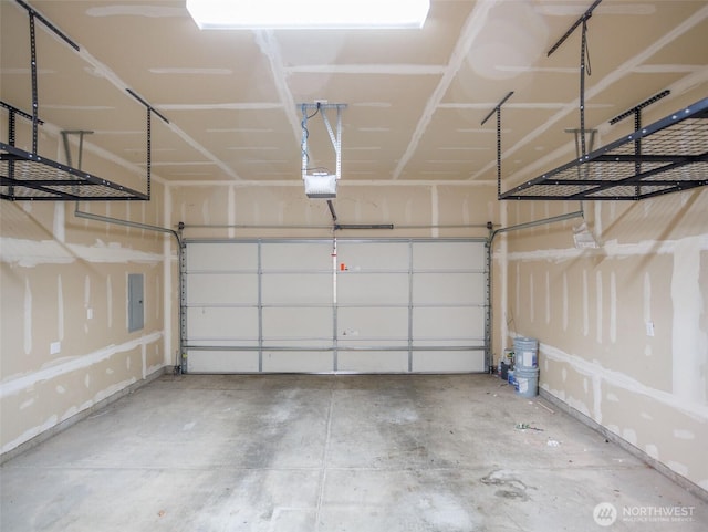 garage featuring electric panel and a garage door opener