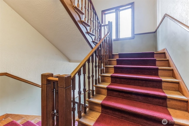 stairway with a textured wall