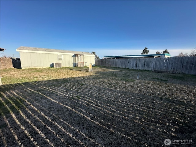 view of yard with fence and cooling unit