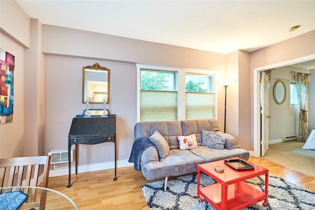 living area featuring light wood-style floors, baseboards, and visible vents