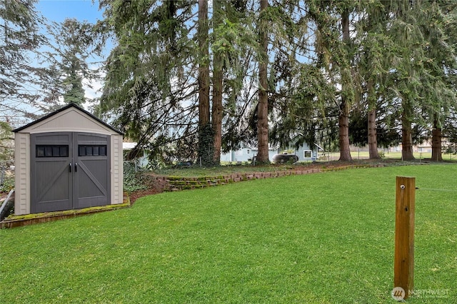 view of yard with a shed and an outbuilding