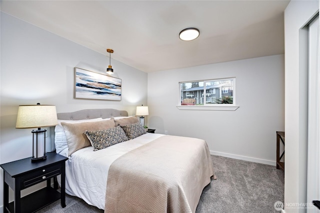 bedroom with carpet floors and baseboards